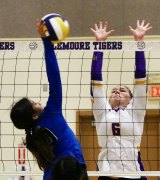 Lemoore's Elizabeth Schalde defends the net against Hanford West Tuesday night in the Lemoore High Event Center.